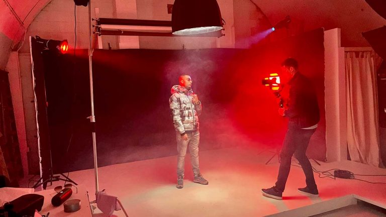 man filming rapper for music video