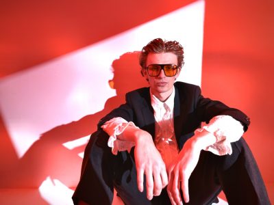 dramatic studio portrait of singer with red light