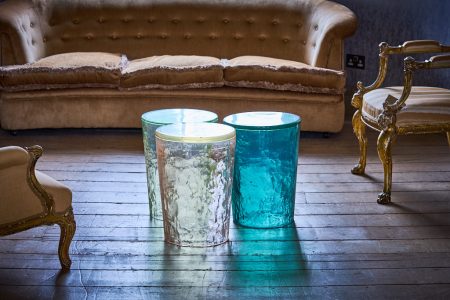 three coloured resin tables / stools in interior