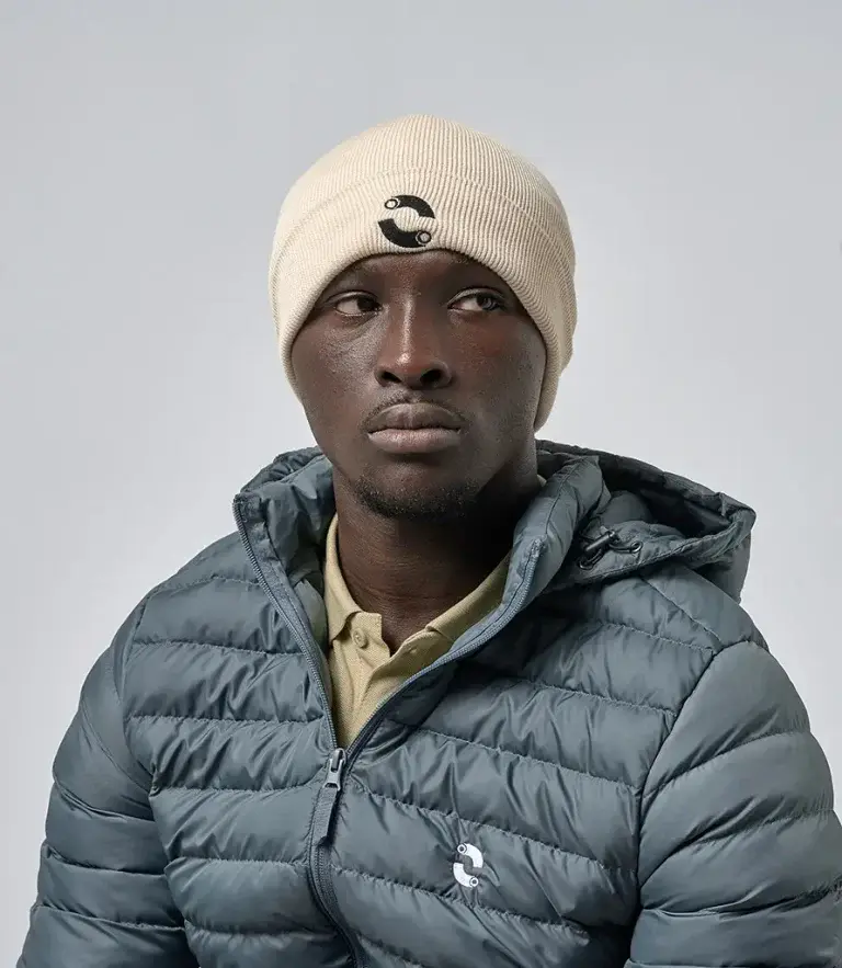 male model in puffer jacket and beanie hat